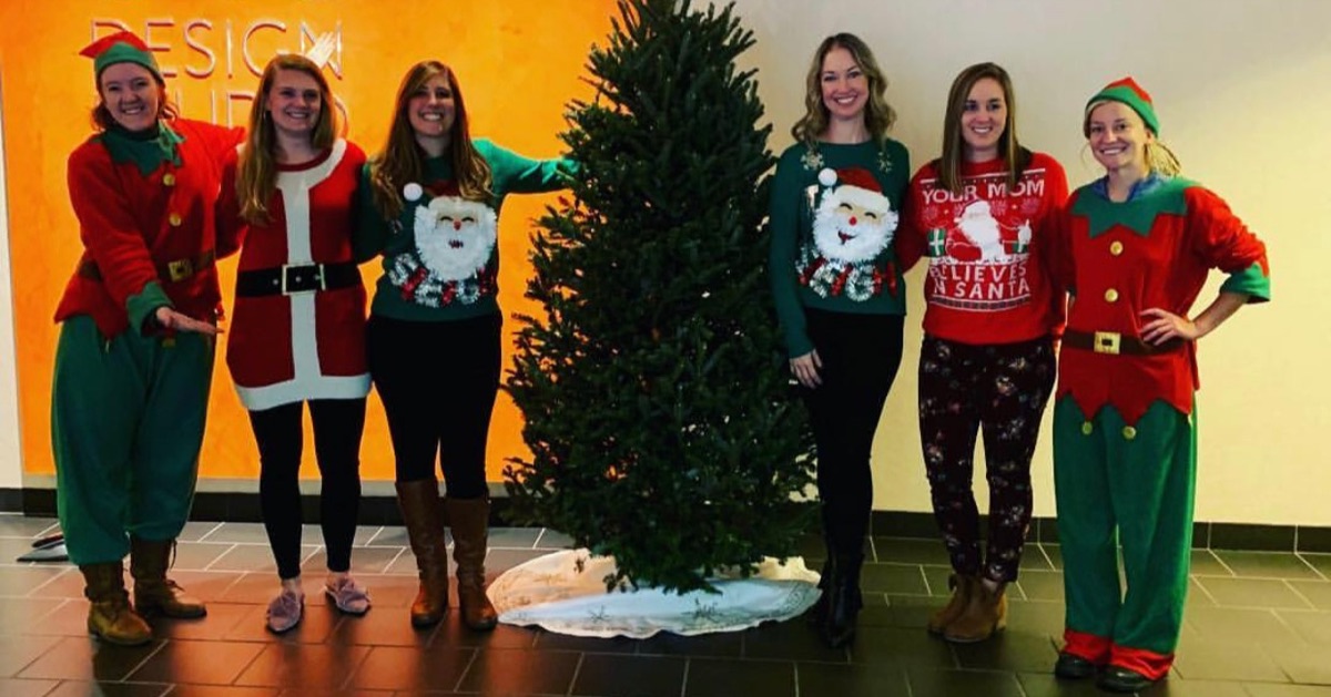 A Fraser fir set up in an Atlanta office lobby, with the elves and the office team